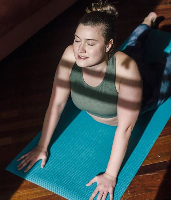 Person practicing mindful movement in a bright, calm space.